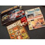 A Scalextric 300 electric model racing game, boxed, picture kits, Etch-a-sketch,