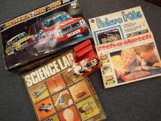 A Scalextric 300 electric model racing game, boxed, picture kits, Etch-a-sketch,