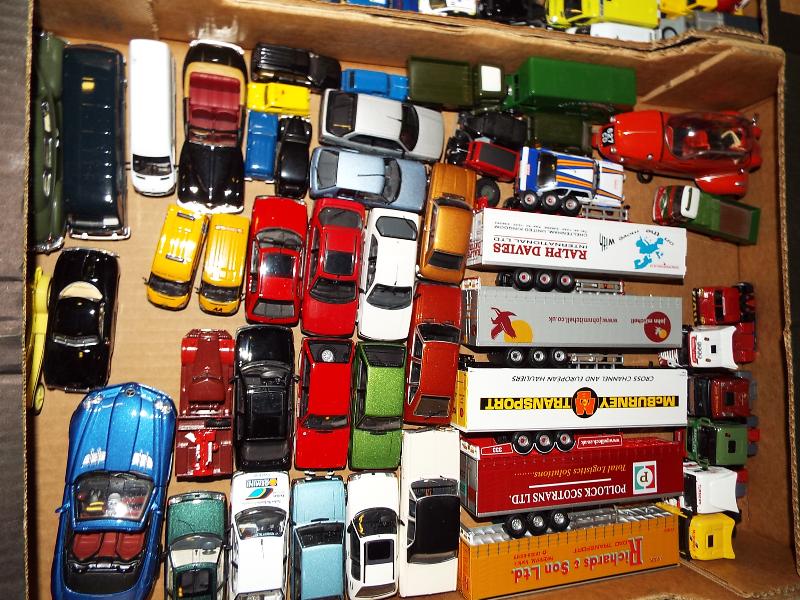 A box containing a large quantity of diecast model motor vehicles, near mint,