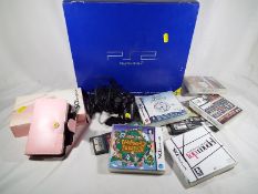 A Sony Playstation 2, boxed with controller and a Nintendo DS lite, pink,