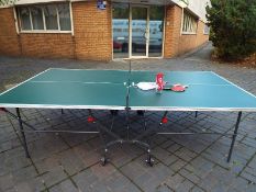 A superior quality full size folding table tennis table by Kettler with bats and balls