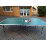 A superior quality full size folding table tennis table by Kettler with bats and balls