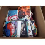 A box containing in excess of 450 45 rpm vinyl singles records
