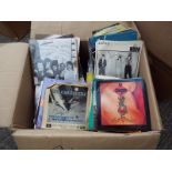 A box containing in excess of 450 45 rpm vinyl singles records