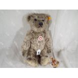 A Steiff classic bear, growler, button in ear with yellow tag # 000553,