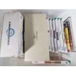 A collection of Nintendo Wii games and a Wii maracas,