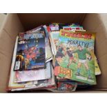 A box of unsorted comics, magazines and