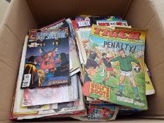 A box of unsorted comics, magazines and