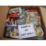 A box of unsorted comics, magazines and