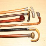 Silver handled walking cane and four oth