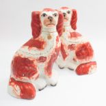 Pair of Staffordshire red painted Spaniel dogs, 26 cms high  Crackling to craze and wear to paint