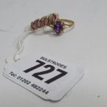 Ladies dress ring on 9ct yellow gold shank inset with an amethyst and one other  Condition - good
