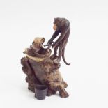 Miniature cold bronze model of a monkey pulling teeth from a hippo.  6.5cm high  Condition - as new