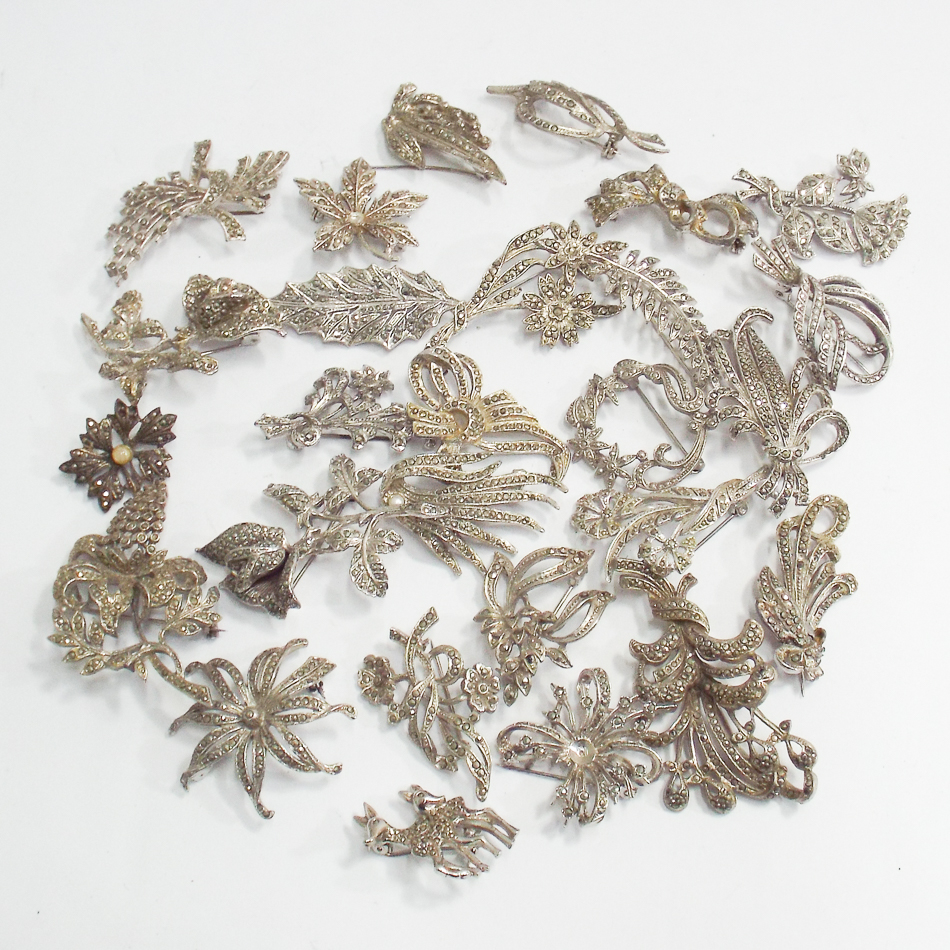 A collection of white metal marcasite se