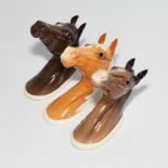 Three Beswick small wall plaques depicting horse heads models 1382, 1384, 1385.  1955-1969, 9cm long