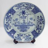 Chinese 18th century blue and white porcelain plate decorated with basket of flowers to the centre.