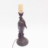 Old spelter table lamp modelled as a heron, 38cm high including bakelite light fitment   There are a