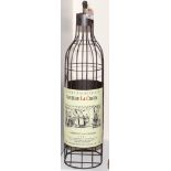 Decorative metal wine rack with Chateau Le Croix label