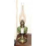 Brass oil lamp with green glass bowl
