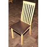 Set of six light oak finished dining chairs with slat backs and leather upholstered seats