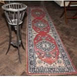 Circular jardinere stand and a figured carpet runner