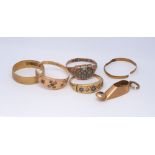 Five 18ct gold and 22ct gold dress rings (some with stones missing) and an 18ct gold Persian