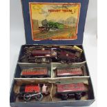 Boxed tin plate Hornby clock work train set and an engine and an extra tender