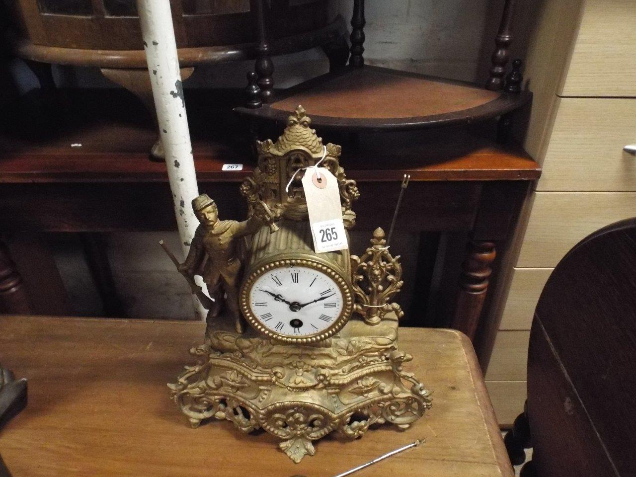 Small French gilt figure decorated mantel clock