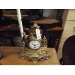 Small French gilt figure decorated mantel clock