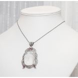 Large carved rock crystal and garnet set Temple god necklace set in silver on a silver chain