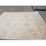 Large cream and patterned Persian style wool pile rug