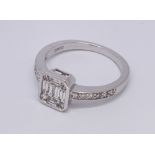 Modern 18ct white gold diamond ring set with oblong panel of baguette and brilliant cut diamonds