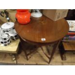 Circular Edwardian inlaid mahogany occasional table with under tier