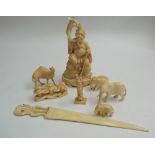 19th Century carved Japanese ivory figure of a sage seated on a rock, 14cm high and a collection