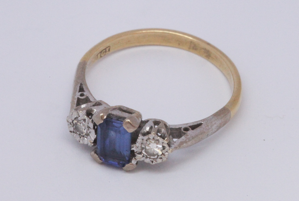 18ct gold sapphire and diamond three stone ring, shank stamped 18ct.