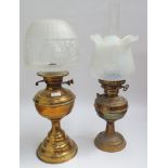 2 Victorian brass oil lamps with glass shades.