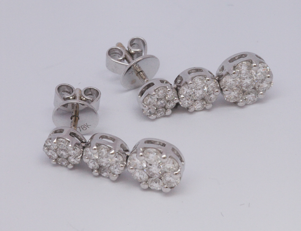 Matching 18ct white gold triple diamond cluster earrings with stud fittings