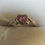 9ct white gold pink sapphire and diamond heart shaped dress ring.