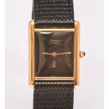 Ladies Must De Cartier silver gilt watch on a black mock croc strap with Cartier clasp in original