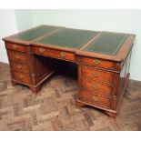 Reproduction mahogany partners desk with green leather top 42" deep x 72" wide