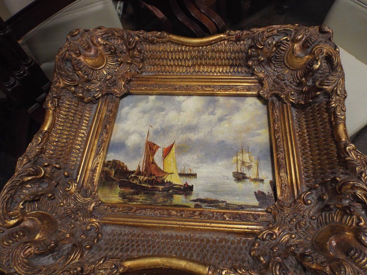 Pair of antique style maritime landscapes in ornate swept gilt frames