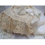 Qty of antique lace items to include Belgian lace examples, collars, small table cloths, mats etc.