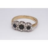 18ct gold three stone sapphire and diamond cluster ring