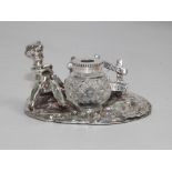 Victorian style silver plated desk stand with cut glass ink well with figural decoration 13cm wide