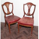Set of four Victorian oak shield back dining room chairs with red leather upholstered seats
