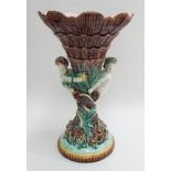 Large late 19th century Majolica table centre piece modelled as mer-men supporting a basket (