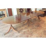 Late Georgian style mahogany triple pillar extending dining table fitted with 2 extra leaves,