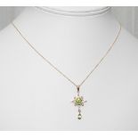 9ct yellow gold peridot and seed pearl pendant on a fine gold chain