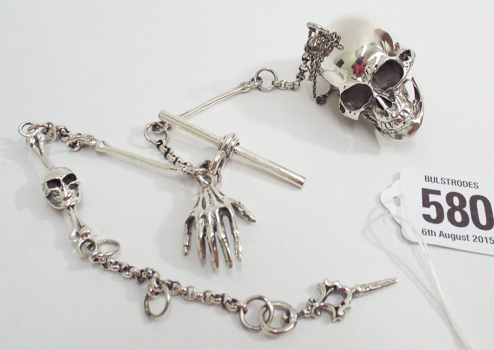 Sterling silver macabre vesta on a watch chain modelled with skulls