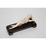 Smaller antique Chinese carved ivory medicine lady complete with hardwood stand.  15cm long